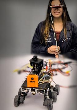 student wears device testing robotic vehicle