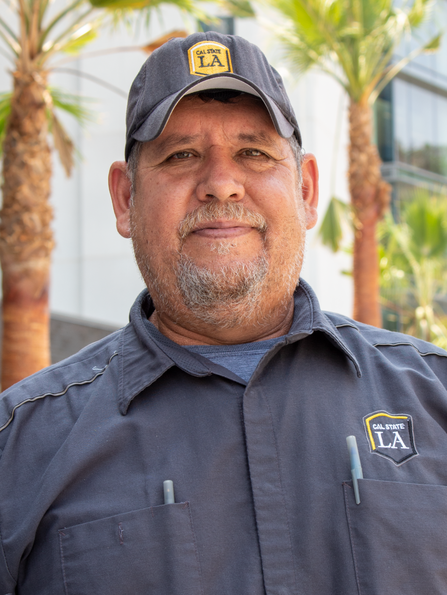 Person wearing a baseball cap with the Cal State LA logo.