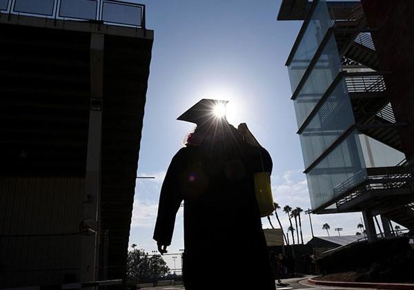 Shadow of a graduate on campus