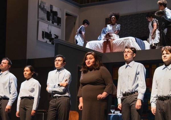 Cast members of "We the Invisibles" stand onstage facing the audience.