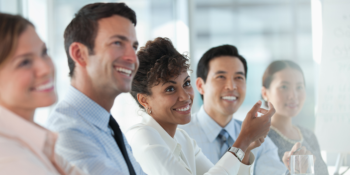 A happy business meeting in a bright room. 