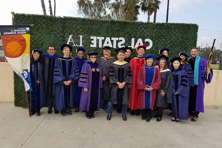 A group of Sociology faculty wearing regalia at Commencement