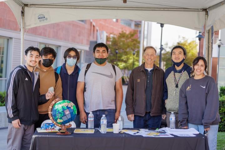 Group of Geosciences and Environment staff and students standing outside of La Kretz Hall at Cal State LA