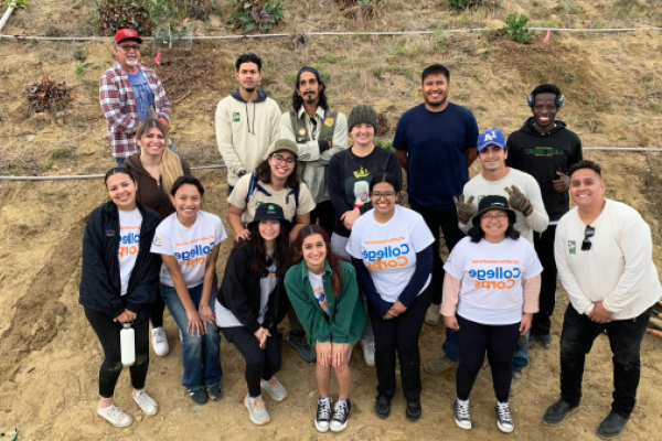 group in front of hill