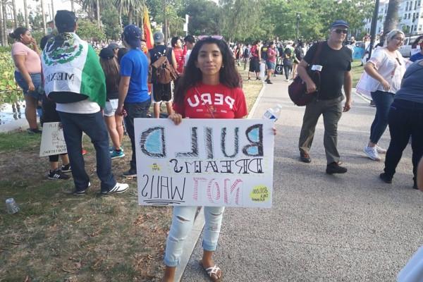 student holding a banner