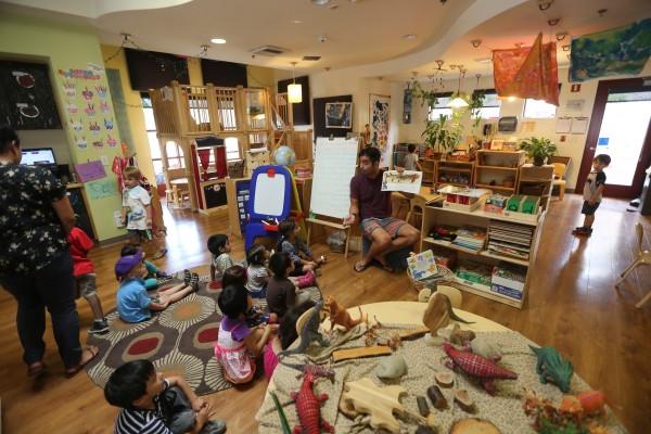 children being lectured in a seated circle