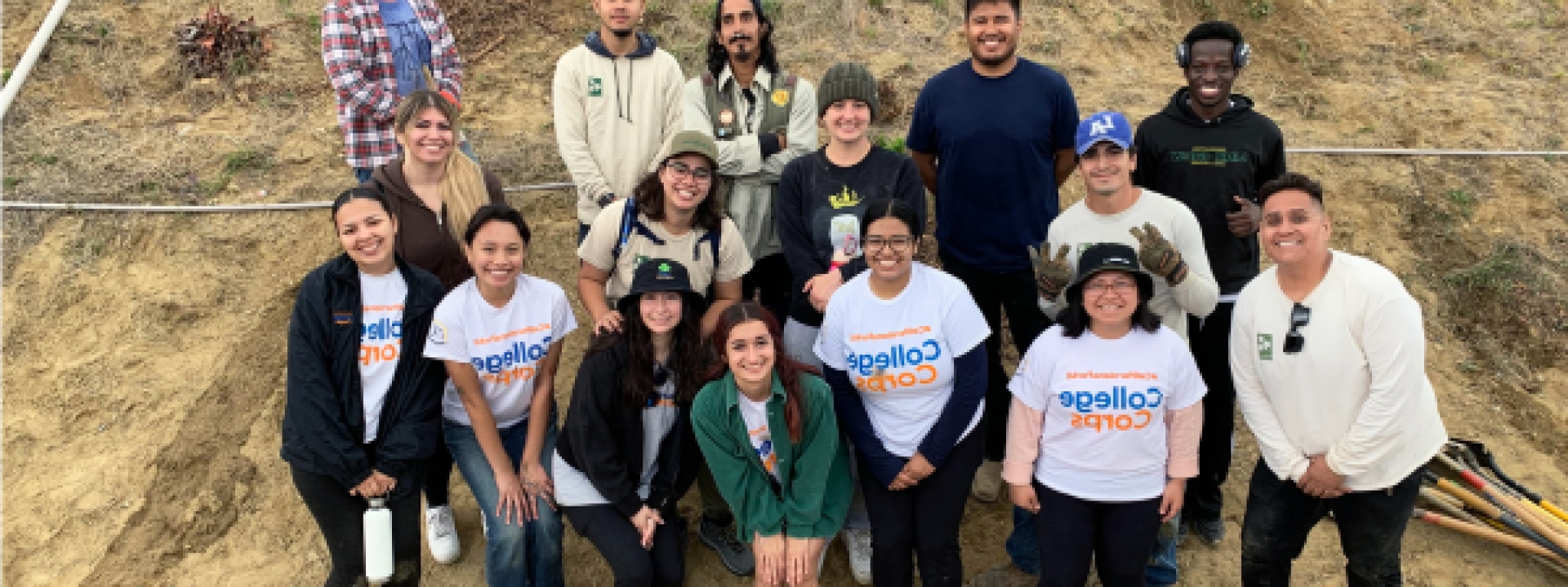 group in front of hill