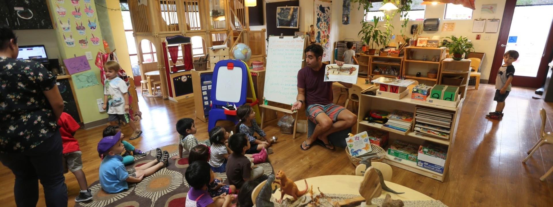 children being lectured in a seated circle