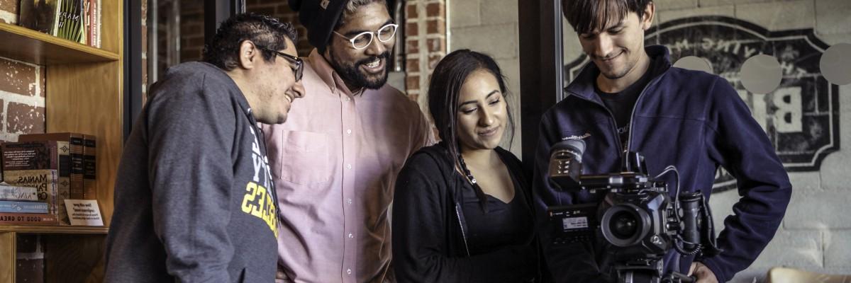 Group of students viewing camera screen